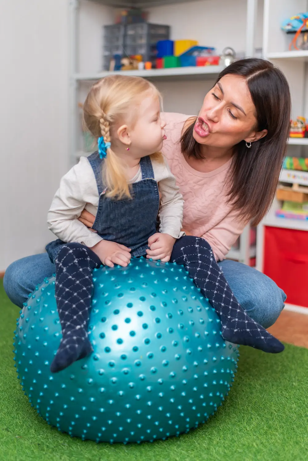 Woman helping a child with therapy in New Jersey