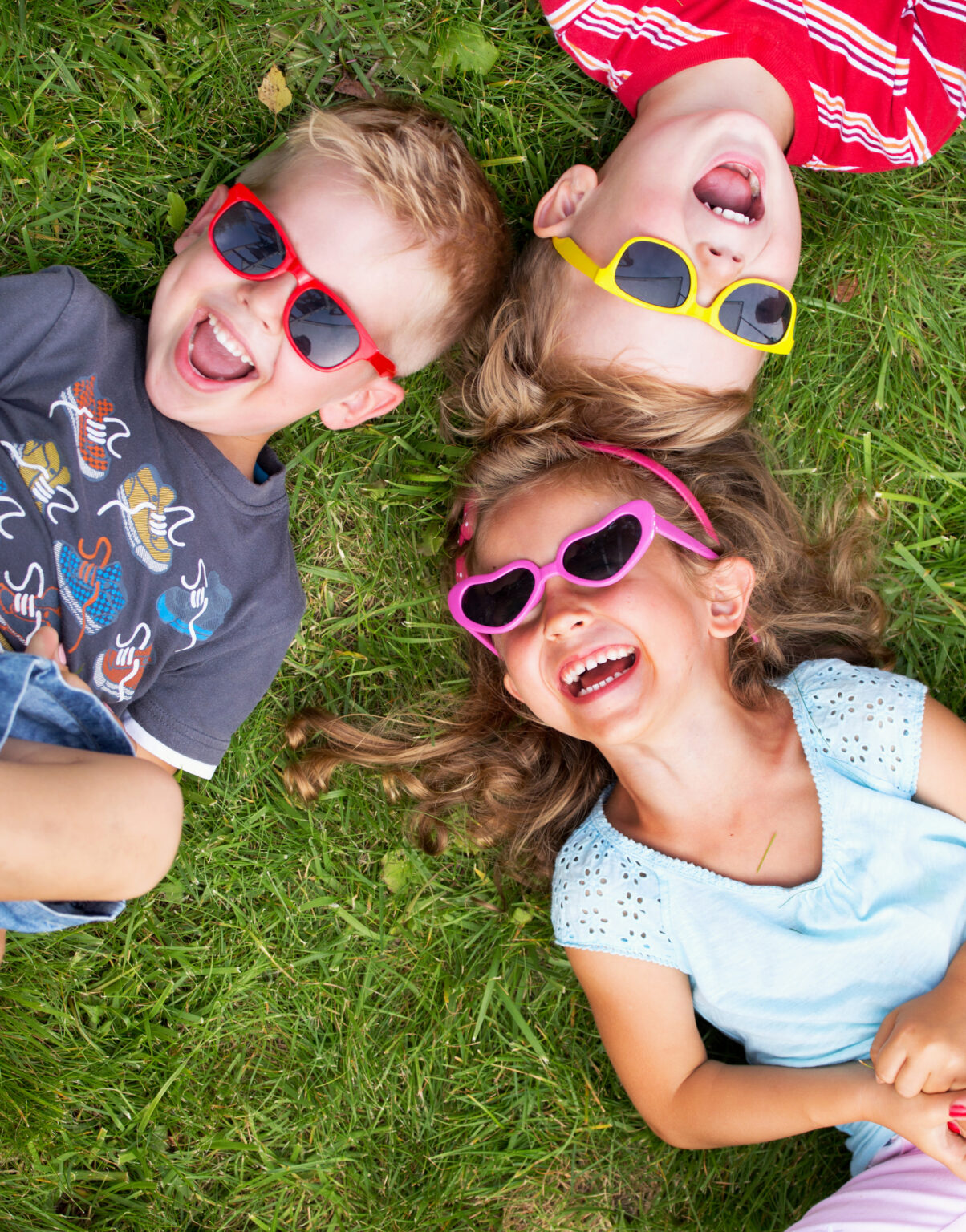 Laughing children relaxing during summer day