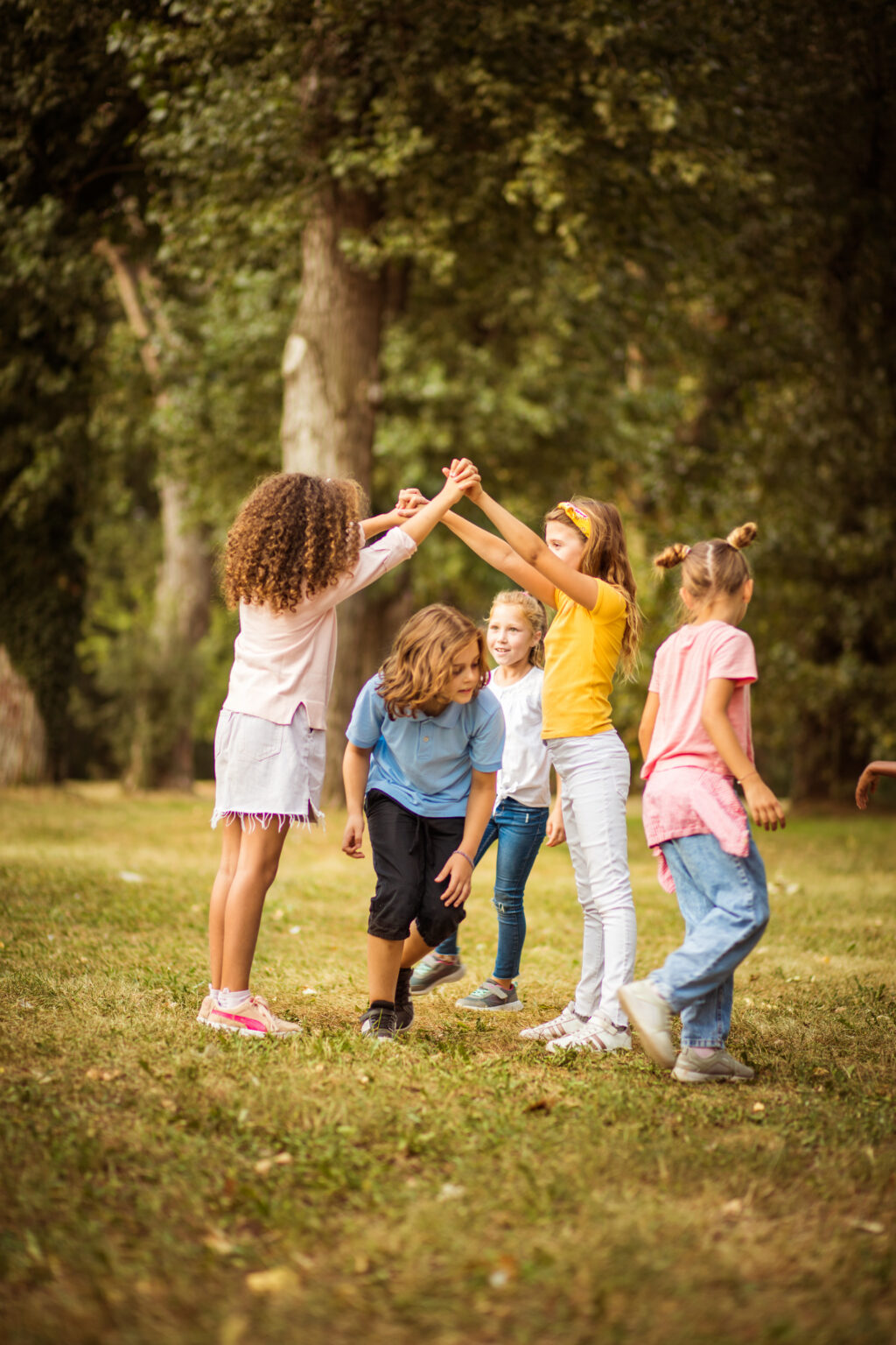 Large group of school kids having fun in nature.