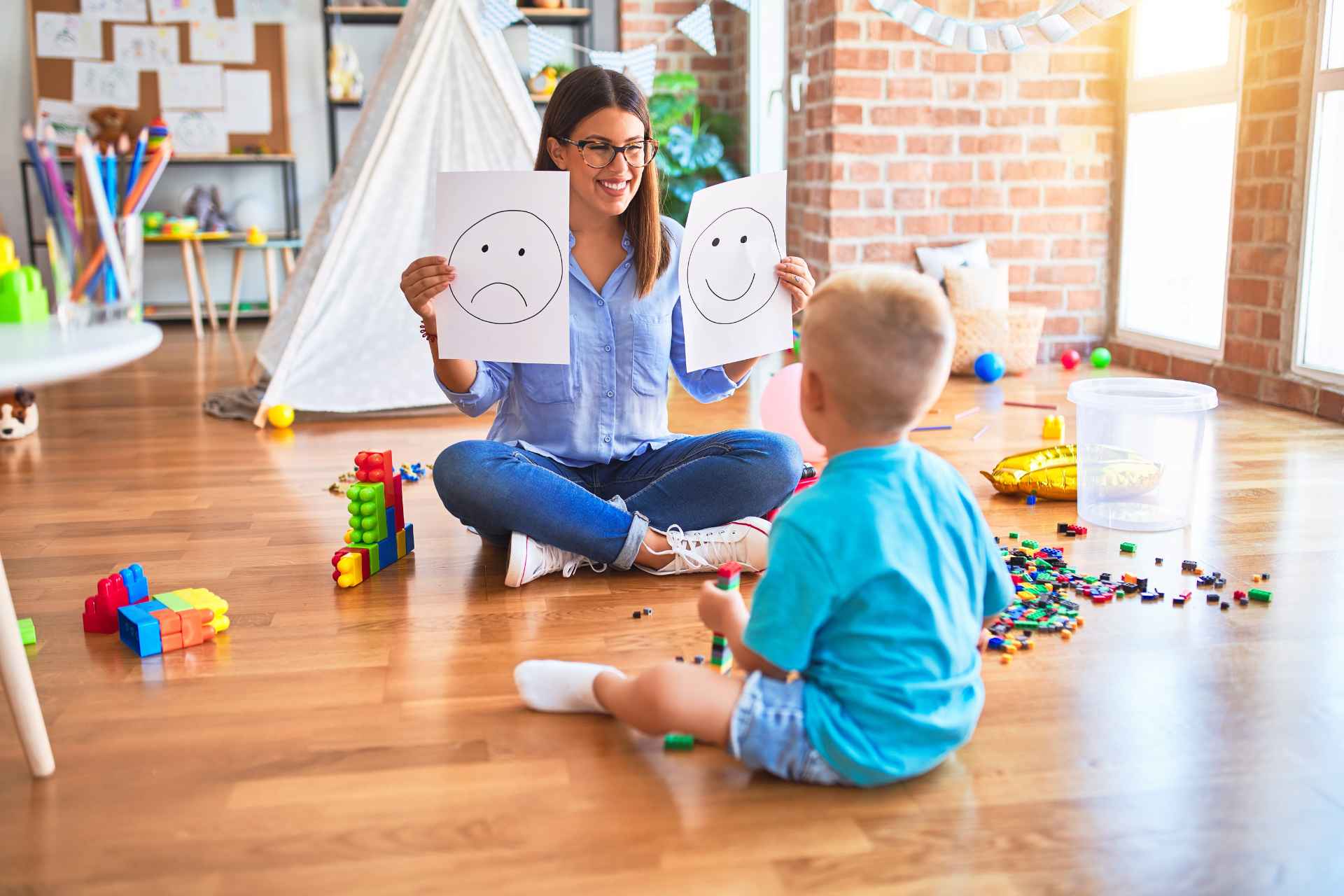 ABA therapist teaching emotional recognition skills to a child in Ocean County NJ