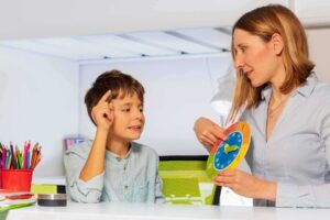 Child practicing learning skills with an ABA therapist