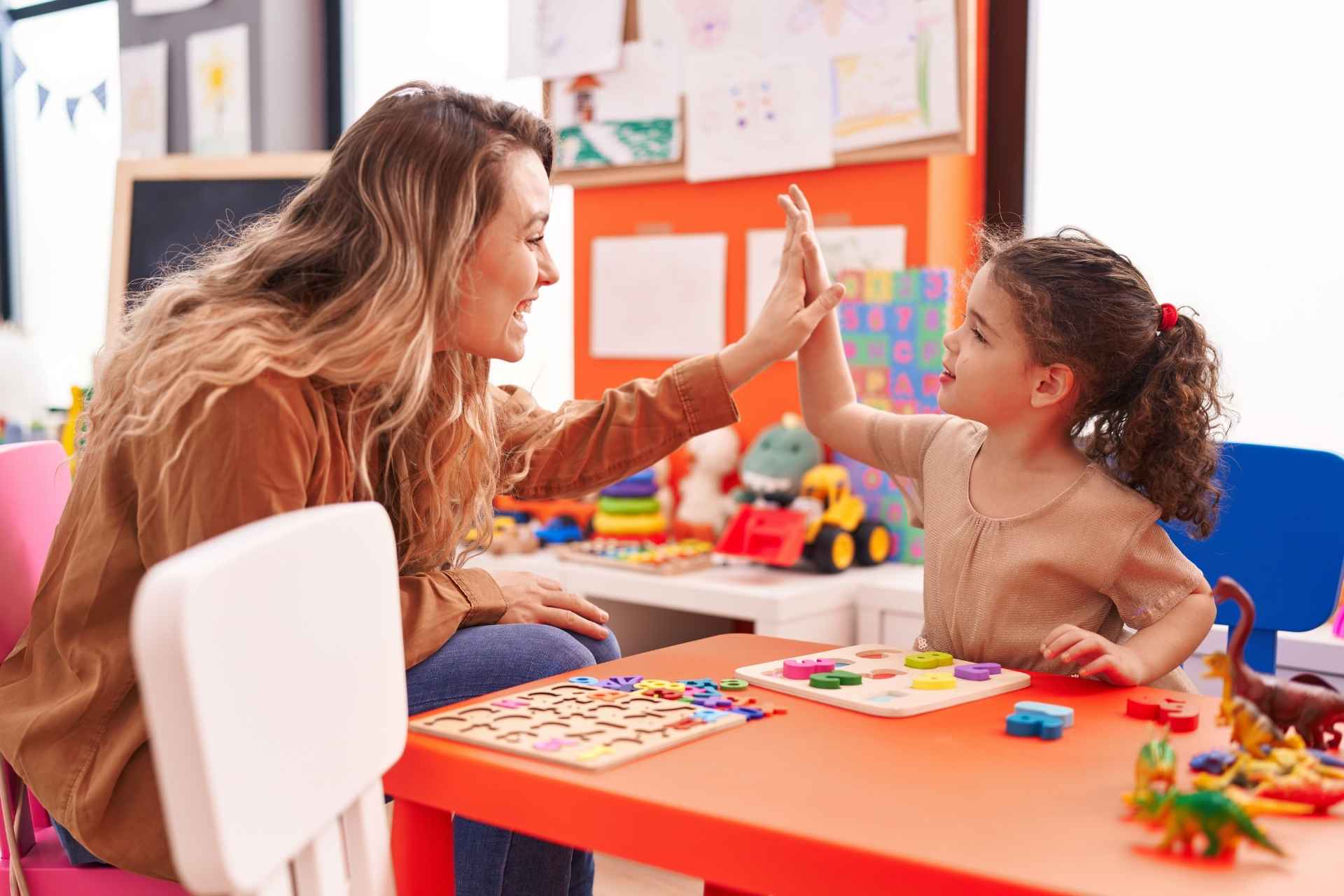 Trauma-informed therapist encouraging a child