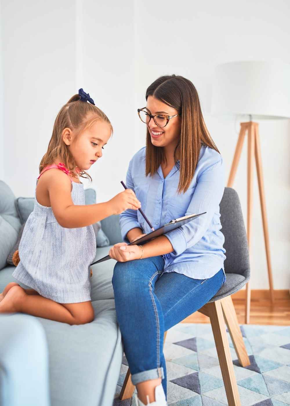 Young child completing a learning activity with an ABA therapist